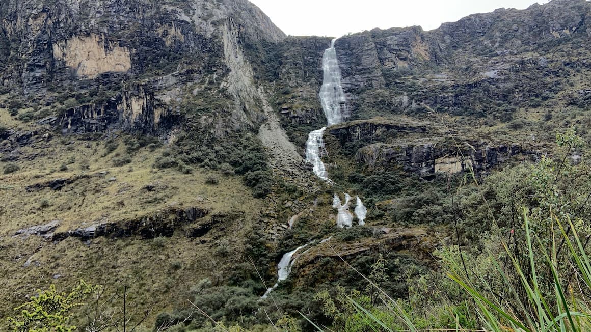 a waterfall in the mountains of peru 