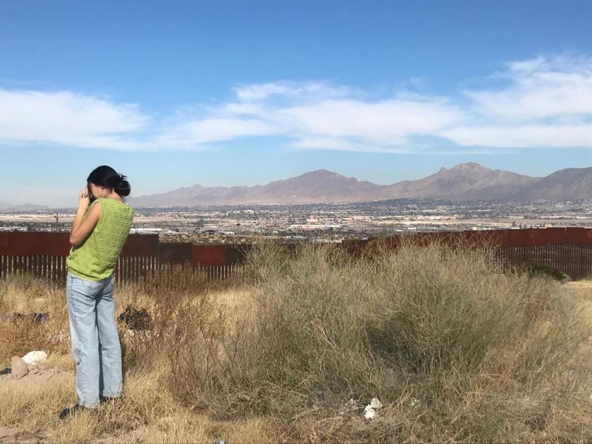 A person looking out at the mountains of San Antonio