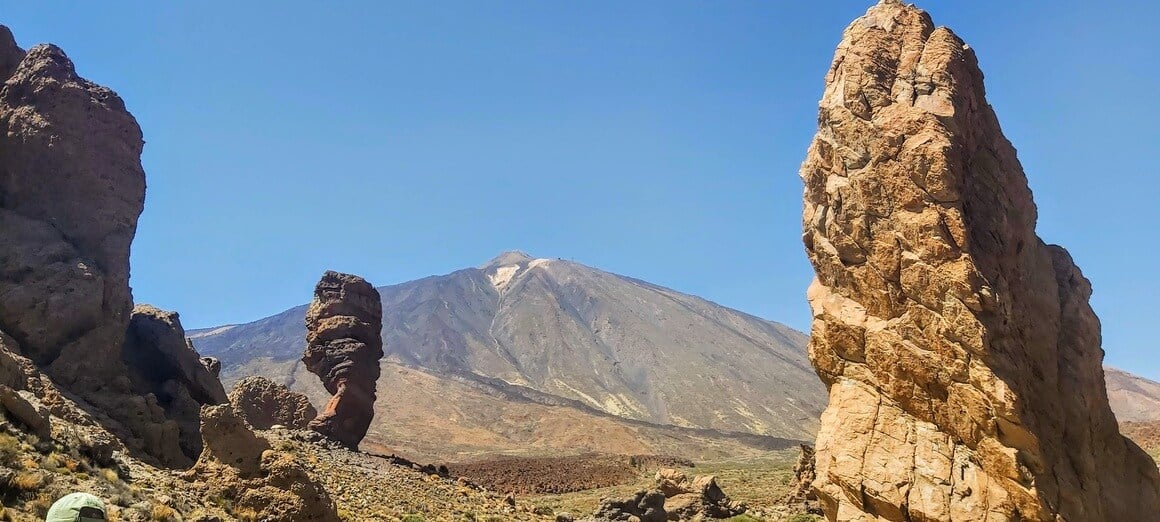 Los Roques de Garcia with El Teide volcano behind on a sunny afternoon.