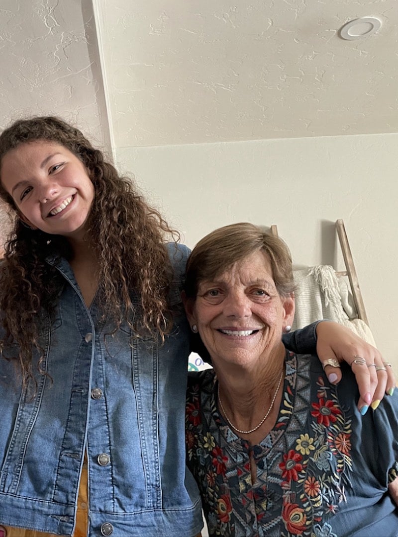 Girl hugs grandma happily in Tucson, Arizona. 