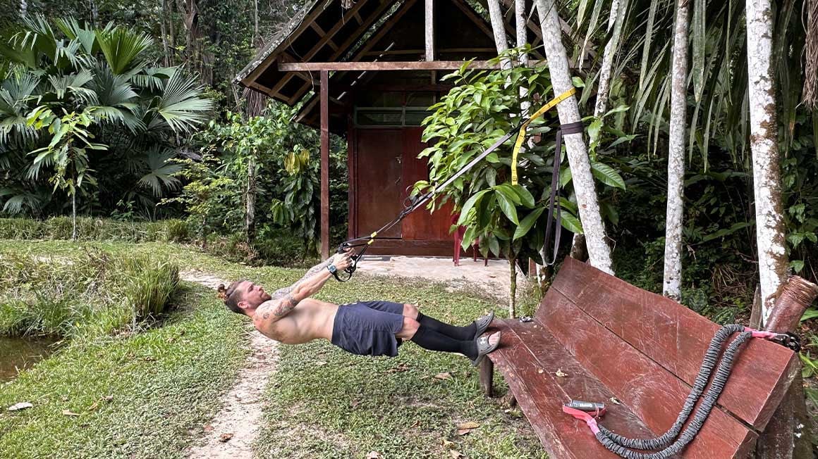 Man doing exercises in the amazon jungle.
