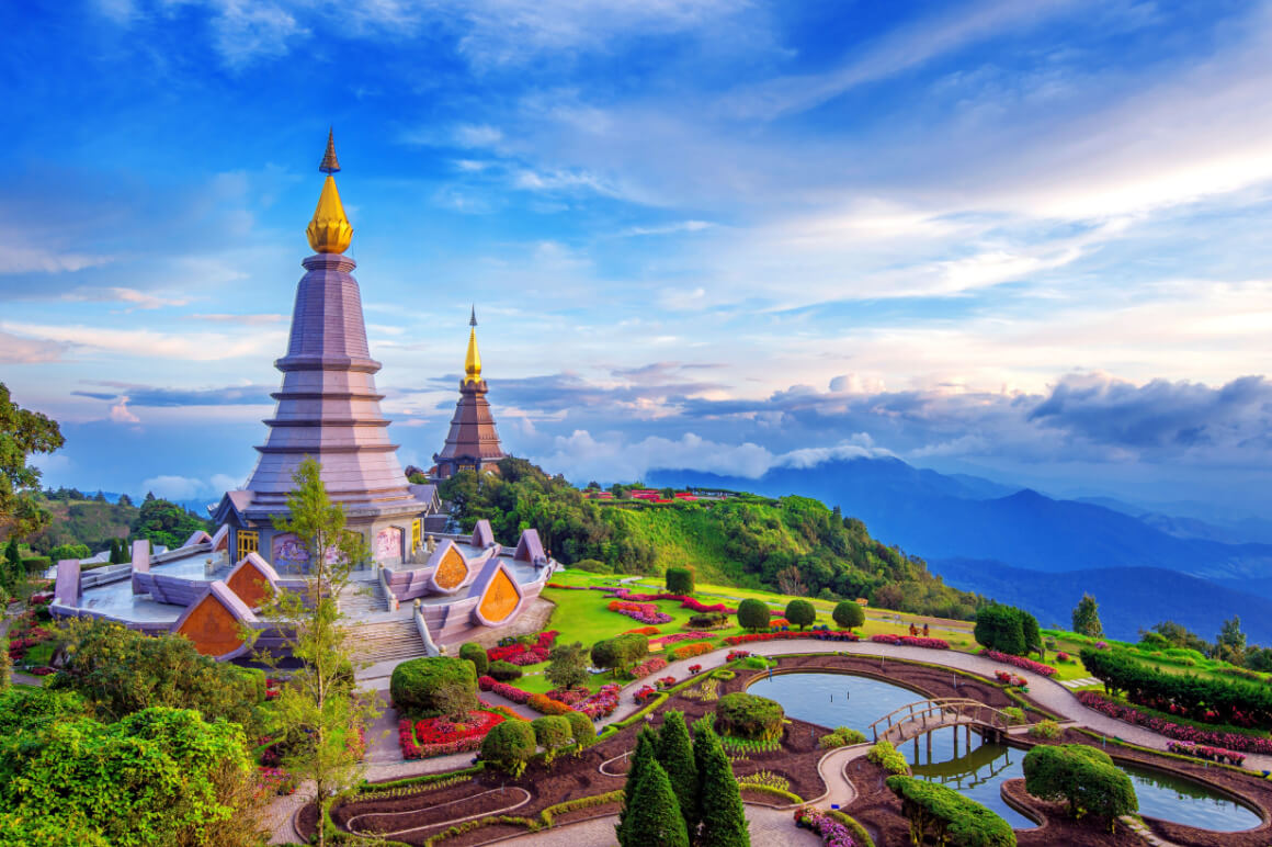 A pagoda on top of a lush and colourful hillside in Doi Inthanon National Park, Thailand