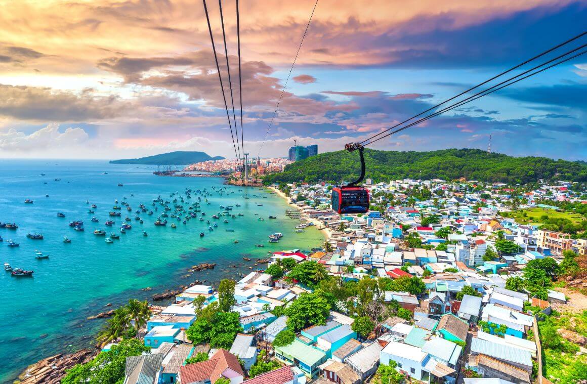An areal shot of Phu Quoc Island's coastline and buildings from a cable car 