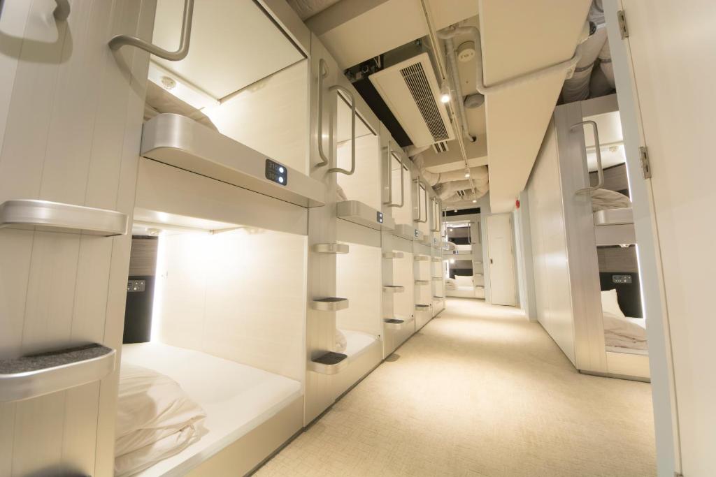 White, large two level capsule rooms in Akihabara Bay Hotel