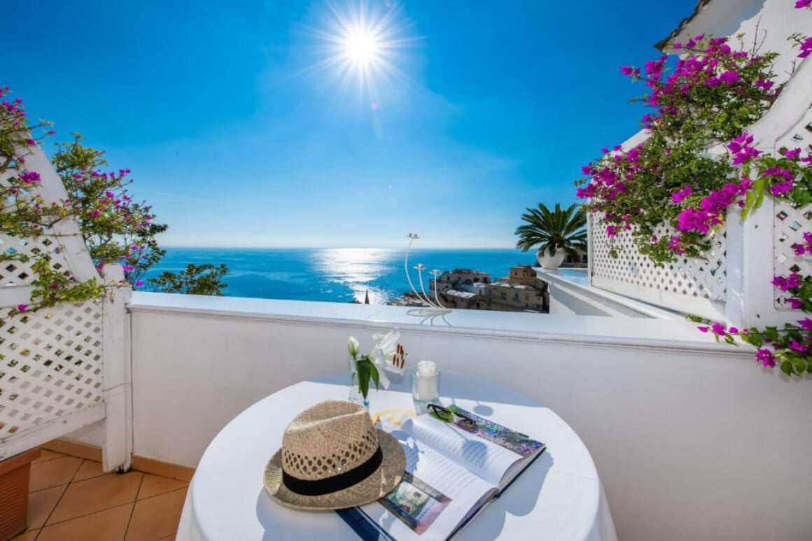 Beautiful view from the terrace and out to the ocean with lovely pink flowers