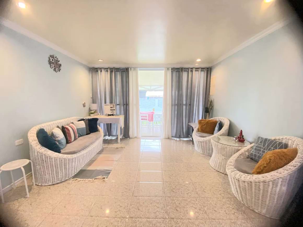 Living area with furniture in an Airbnb in Barangay San Jose