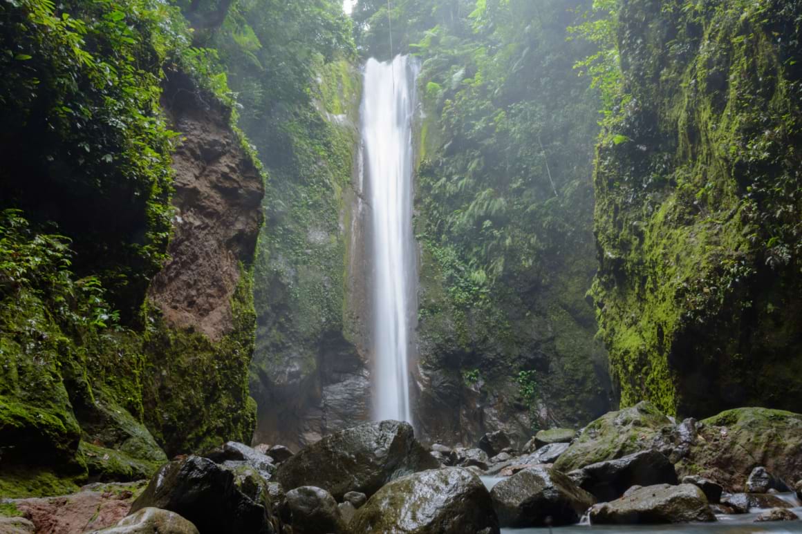 Casaroro waterfall cascading down a rocky cliff in Dumaguete