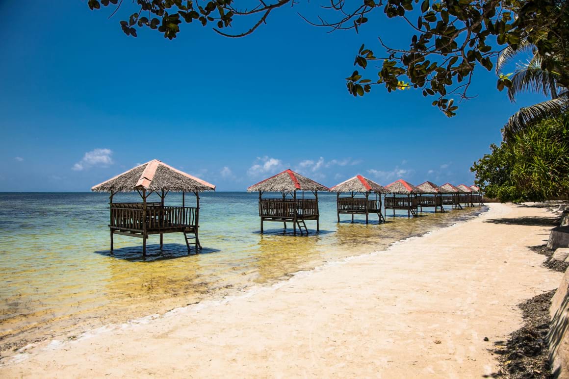 Overwater huts overwater huts built on stilts over the water in Hartman Beach in Puerto Princesa