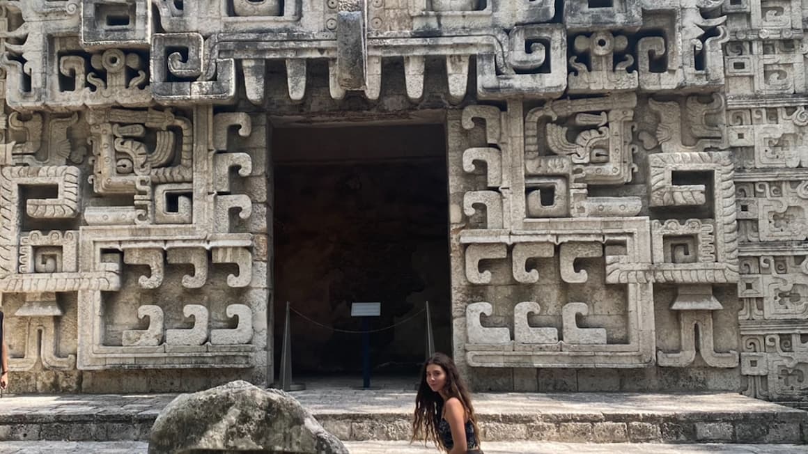 a girl walking up to a archaeology exhibit museum in mexico city 