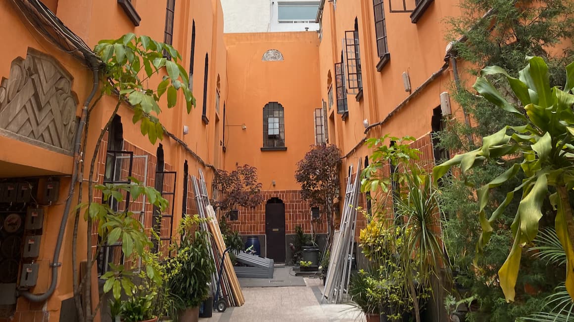 A vibrant orange apartment complex in mexico city