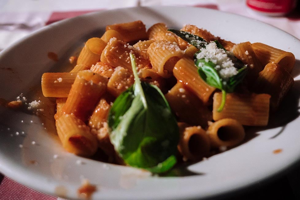 Pasta with tomato, basil and cheese in Italy. Amazing Italian food.