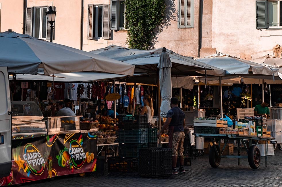 Vendors setting up for the day at a local market in Lake Garda