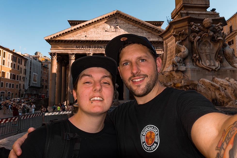 A couple posing for a selfie in front of the Pantheon in Rome, Italy
