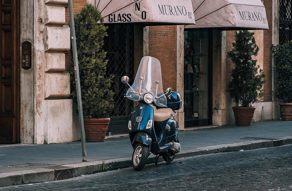 A vespa scooter on the streets of Italy