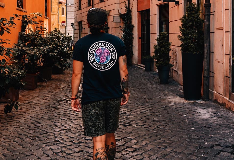 A person walking down a street in Rome, Italy