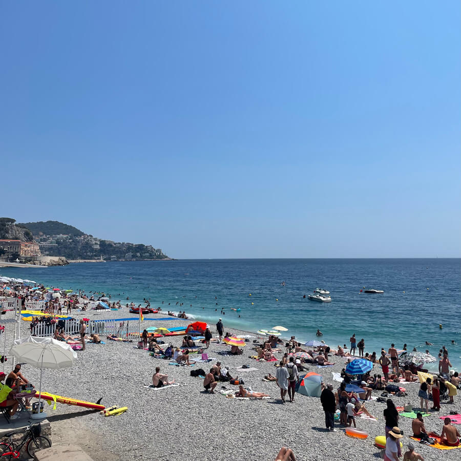 View over beach full of people on a beautiful sunny day