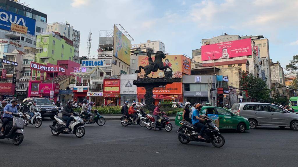 Equestrian Statue of Phu Dong Thieu Vuong in the middle of bustling streets, Ho Chi Minh City, Vietnam.