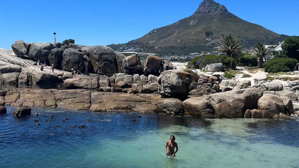 a guy solo in the water enjoying the Cape Town beach 
