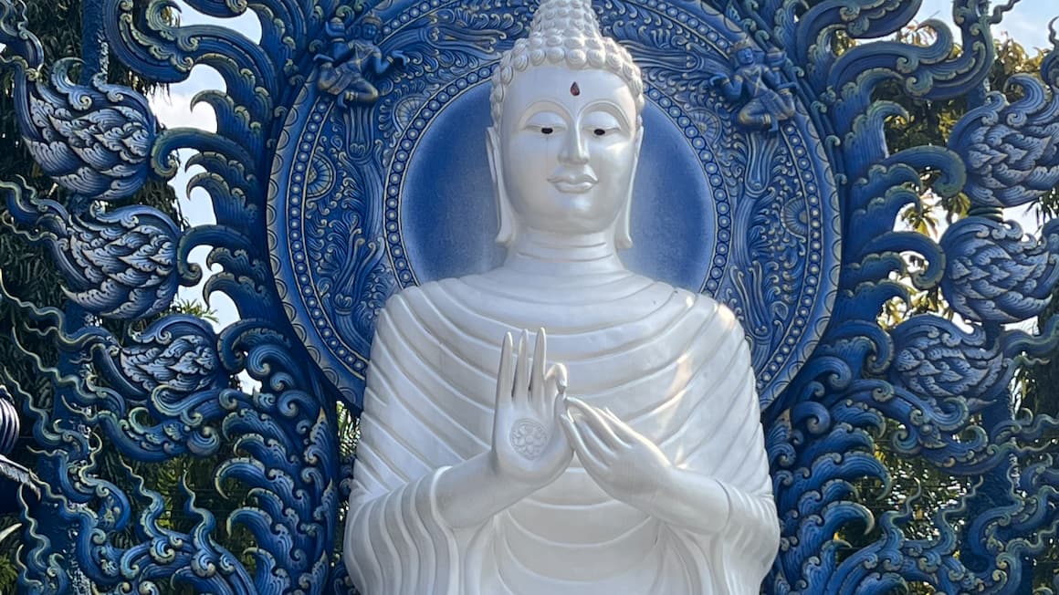 a blue and white statue in a temple in northern Thailand 