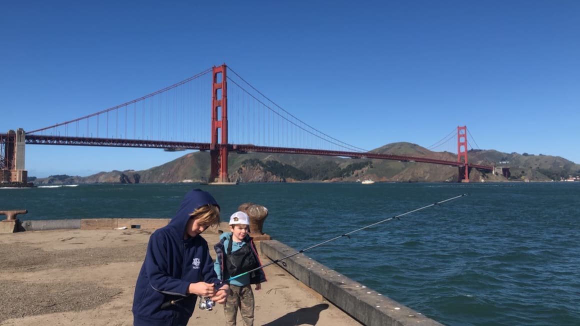 Kids fishing near the golden gate bridge 