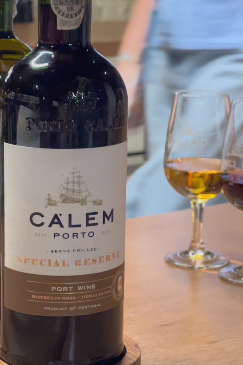 a bottle of special reserve port wine and two glasses during a wine tour in porto
