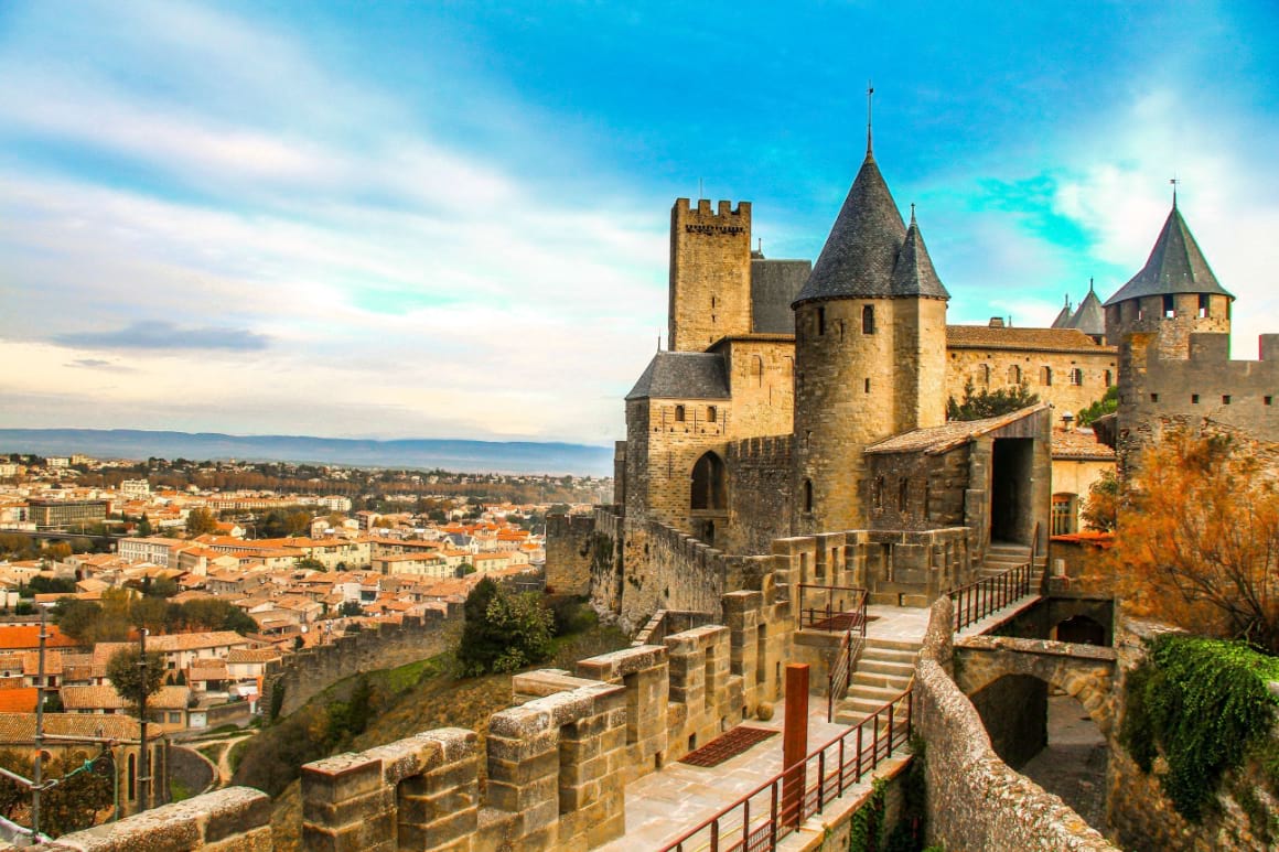 Cite de Carcassonne sitting on top of a hill with views of the Camens