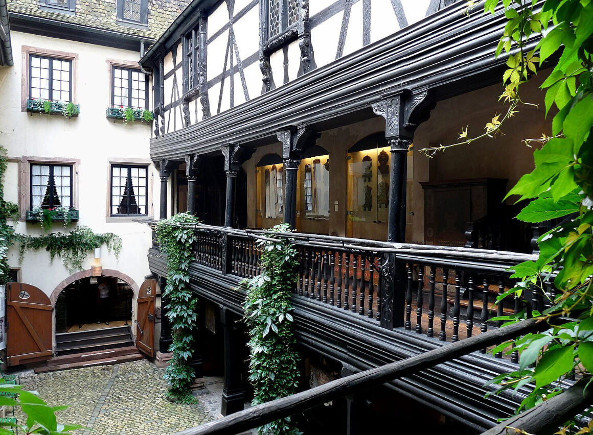 Alsatian Museum in Strasbourg with a balcony overflowing with plants