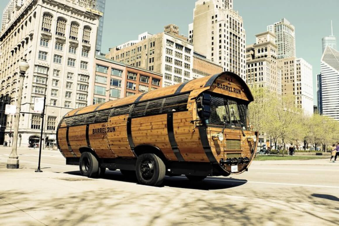 bus shaped like a giant wooden barrel with Chicago buildings in the backdrop