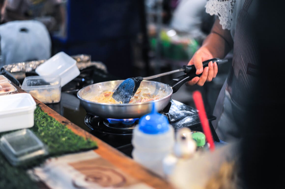 A vendor prepares a Thai dish in Hua Mum Night Market