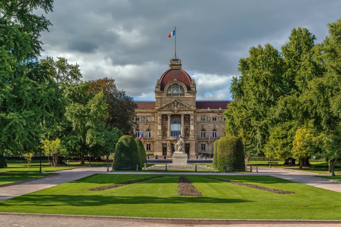 Palace of the Rhine decorated with statues and sculptures and a large garden in Strasbourg France