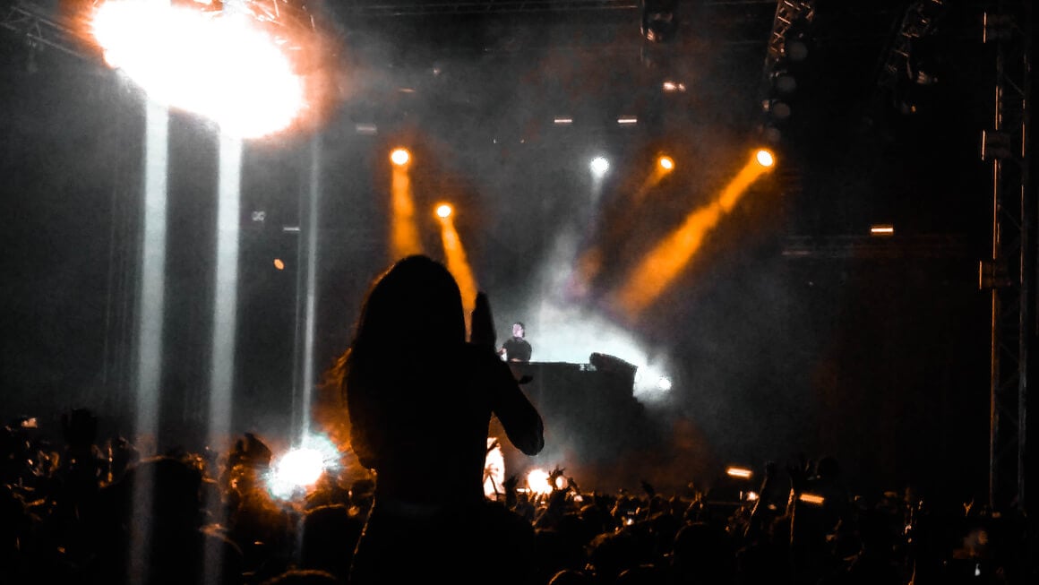 Girl clapping in a music festival in Goa