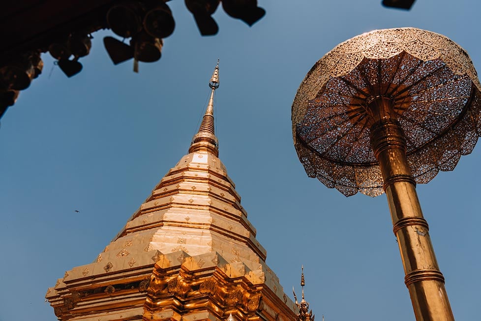 A golden stupa and umbrella at a temple in Chiang Mai, Thailand