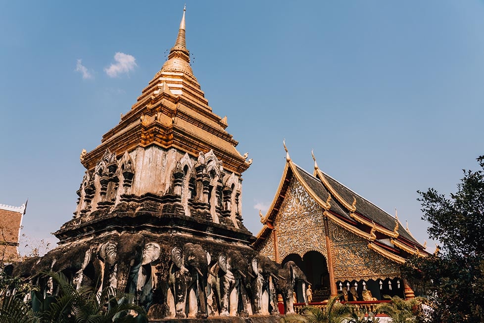 A detailed temple and stupa with elephant statues in Chiang Mai, Thailand