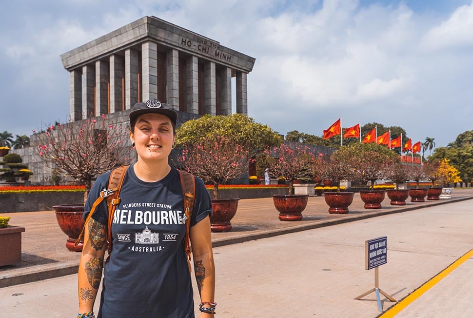 A person standing in front of Ho Chi Minh's mausoleum in Hanoi, Vietnam