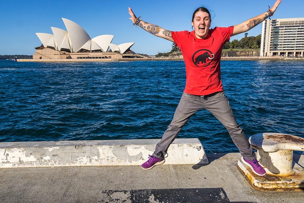 A person jumping in front of the Sydney Opera House in New South Wales, Australia