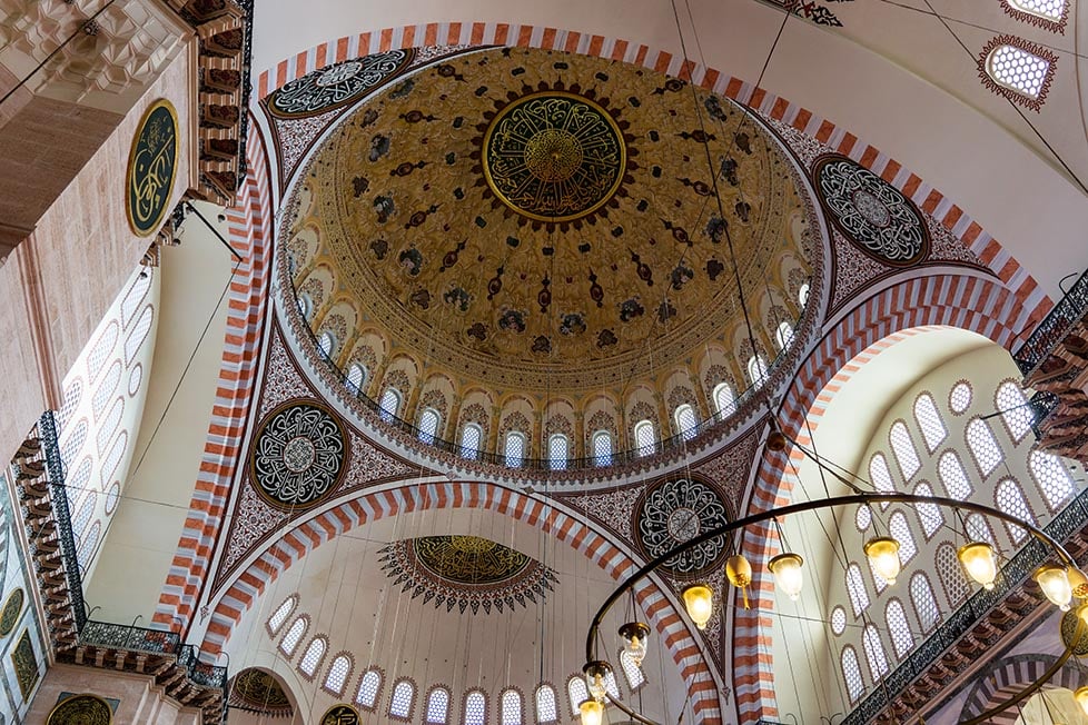 The details and ornate decoration of a dome in a mosque in Istanbul, Turkey