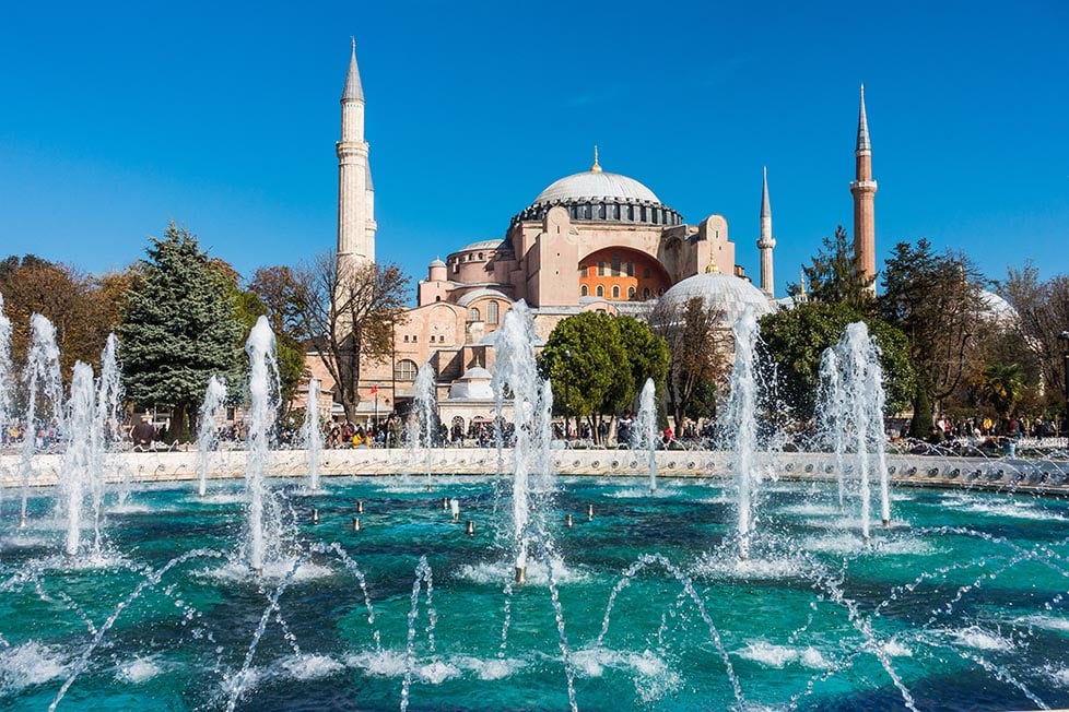 The Hagia Sophia Mosque in Istanbul, Turkey with fountains in front.