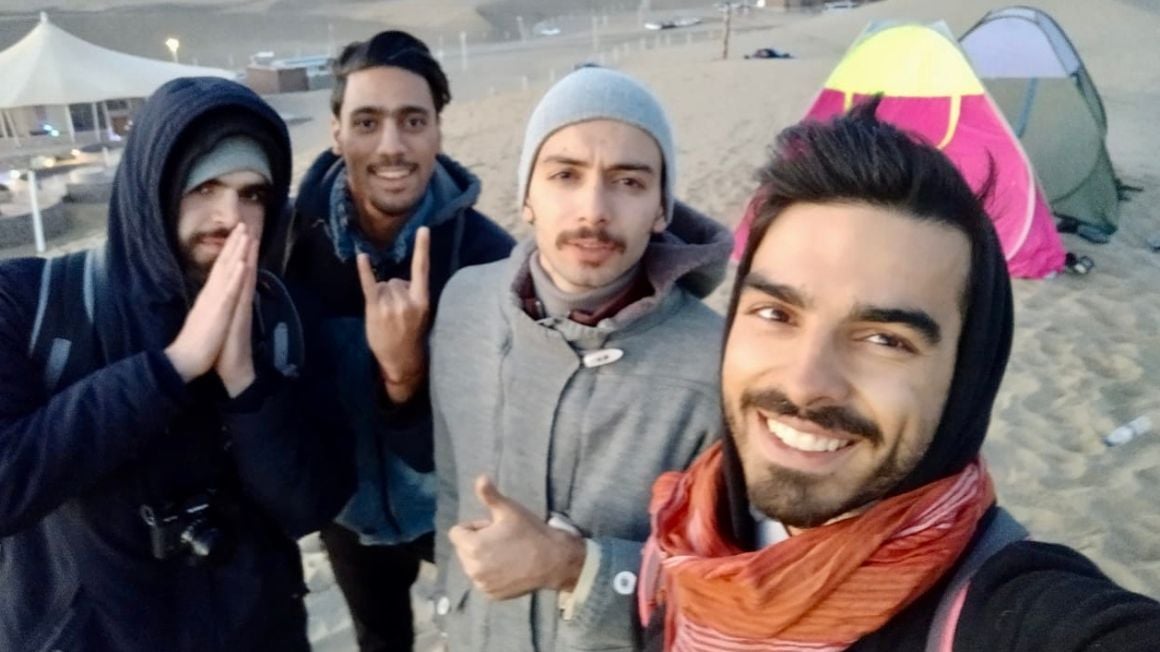 a group of friends in the desert. varzaneh, iran