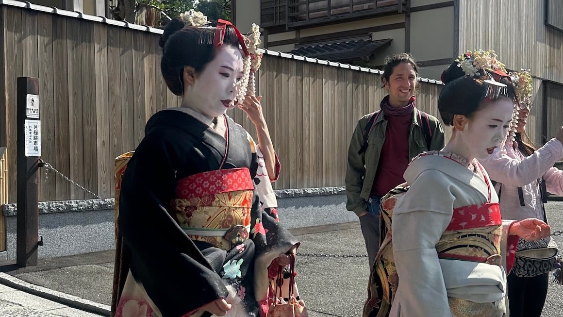 Traditionally dressed geishas walking the streets of Kyoto.
