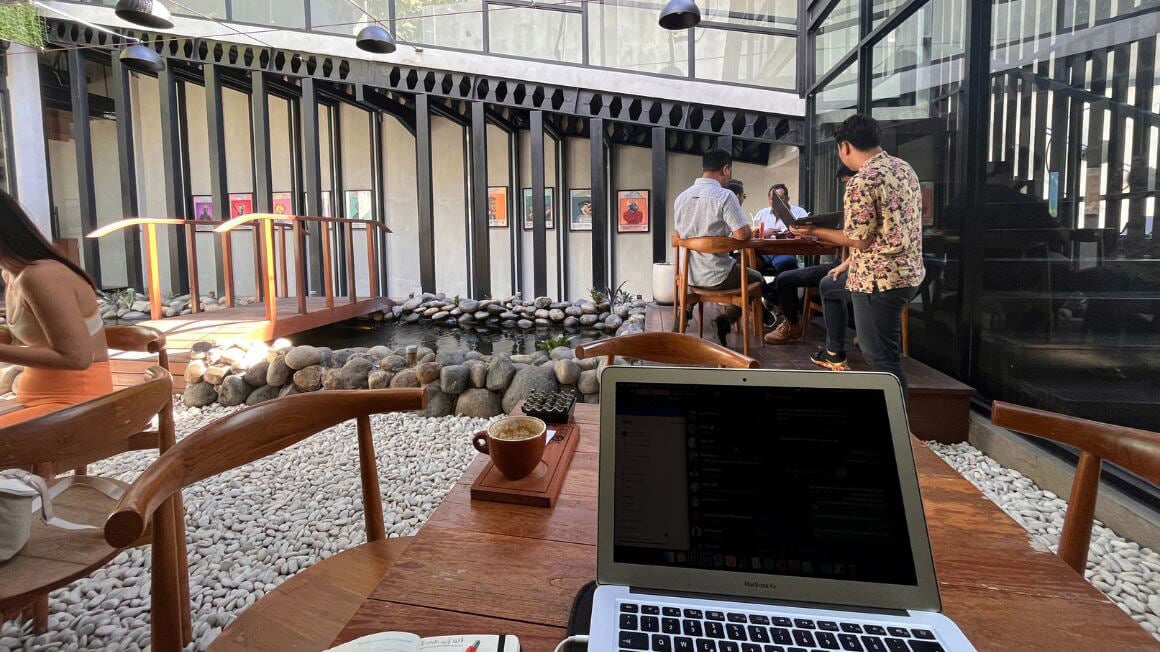 remote worker doing some work at a cafe in Seminyak, bali