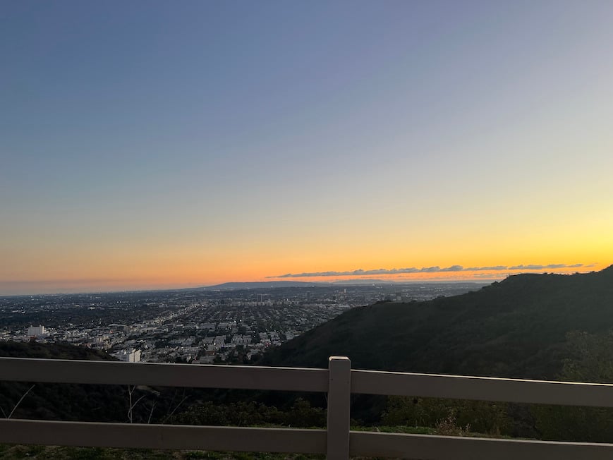 orange sunset over los angeles california as seen while hiking