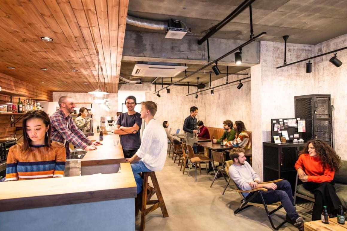 people gathered in Ten to Ten Hostel's communal space