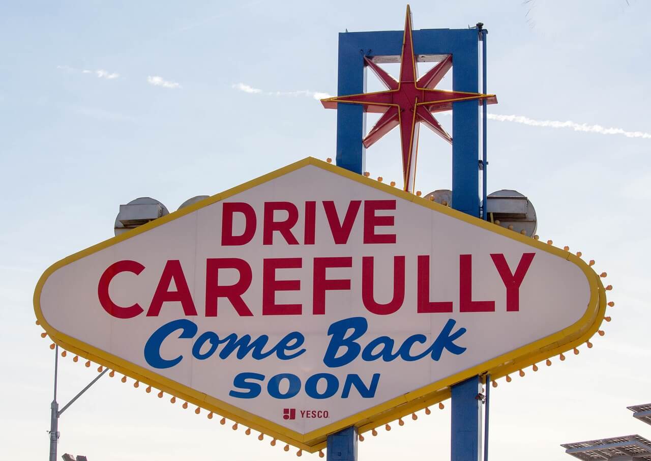 A replica of the back of the "Welcome to Fabulous Las Vegas" sign with the message "Drive Carefully Come Back Soon" 
