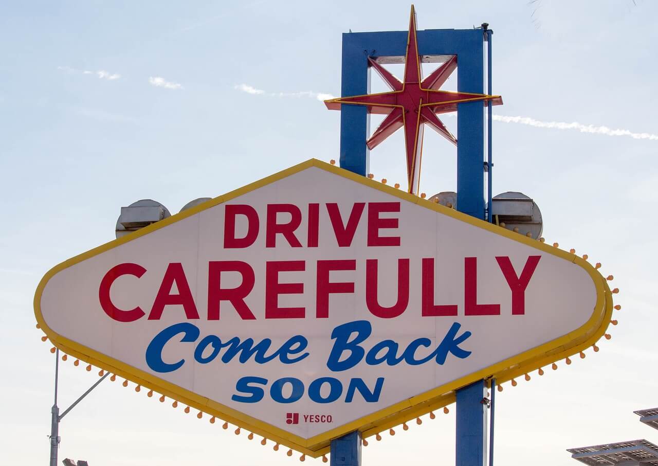 A replica of the back of the "Welcome to Fabulous Las Vegas" sign with the message "Drive Carefully Come Back Soon"