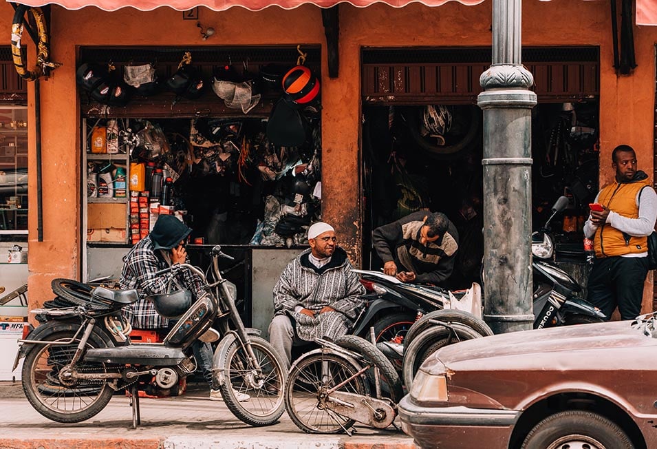 Men outside a mechanic stop in Marrakech, Morocco.