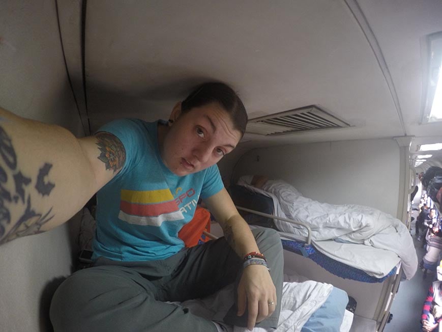 Nic on the top bunk of a sleeper night train in China.