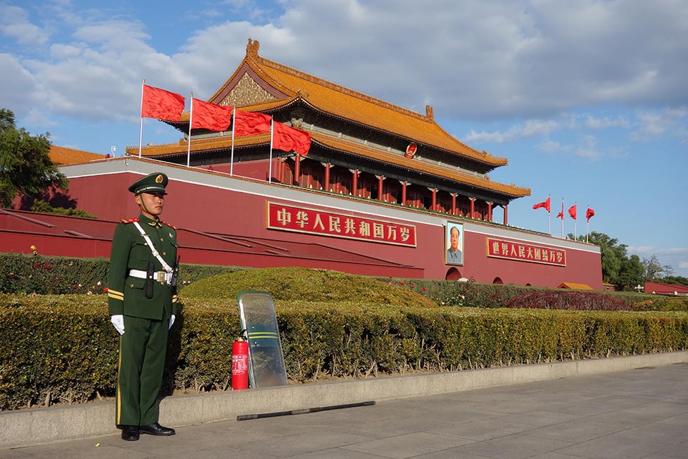 A soldier standing in Tiananmen Square in Beijing, China.