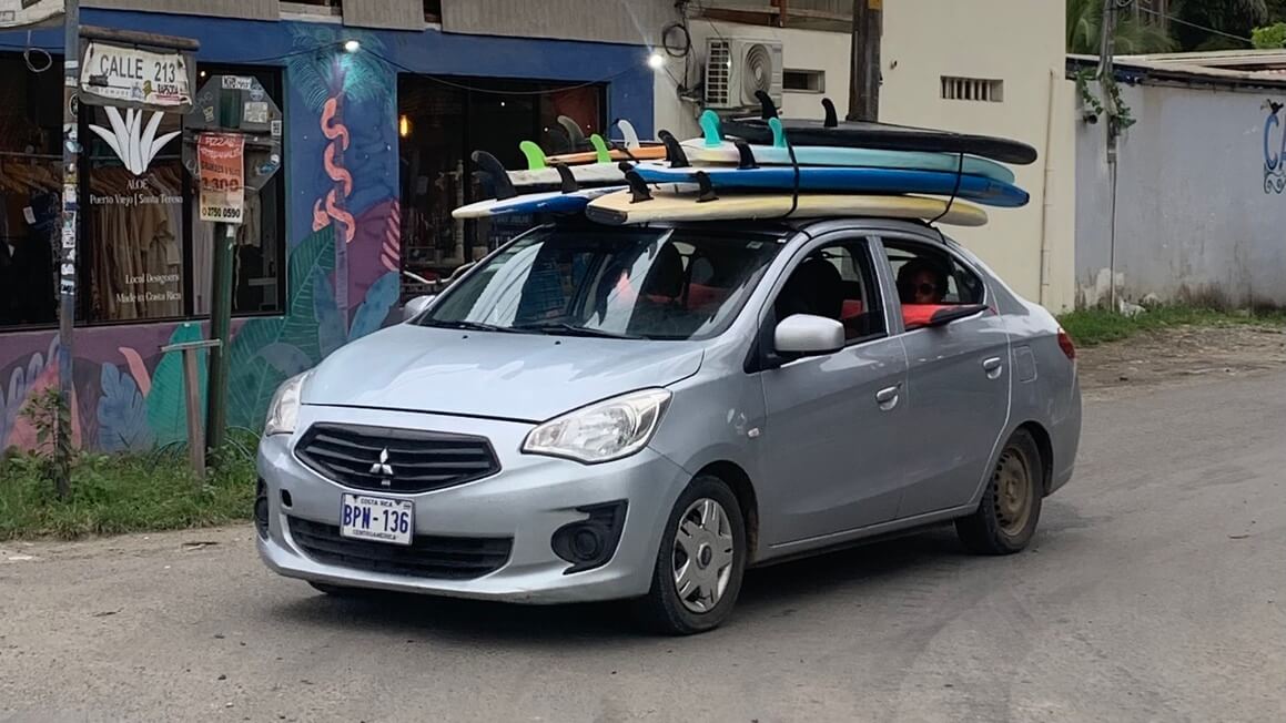 Car overloaded with surfoards in Costa Rica