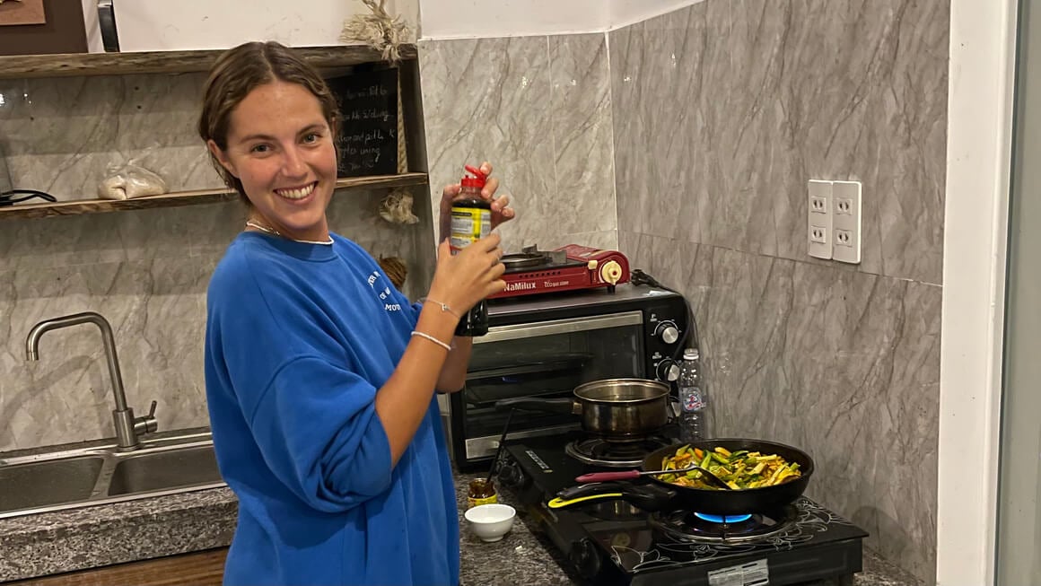 danielle cooking in a hostel