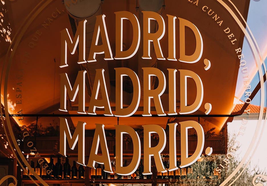 A sign in a cafe in Madrid, Spain that says Madrid, Madrid, Madrid.